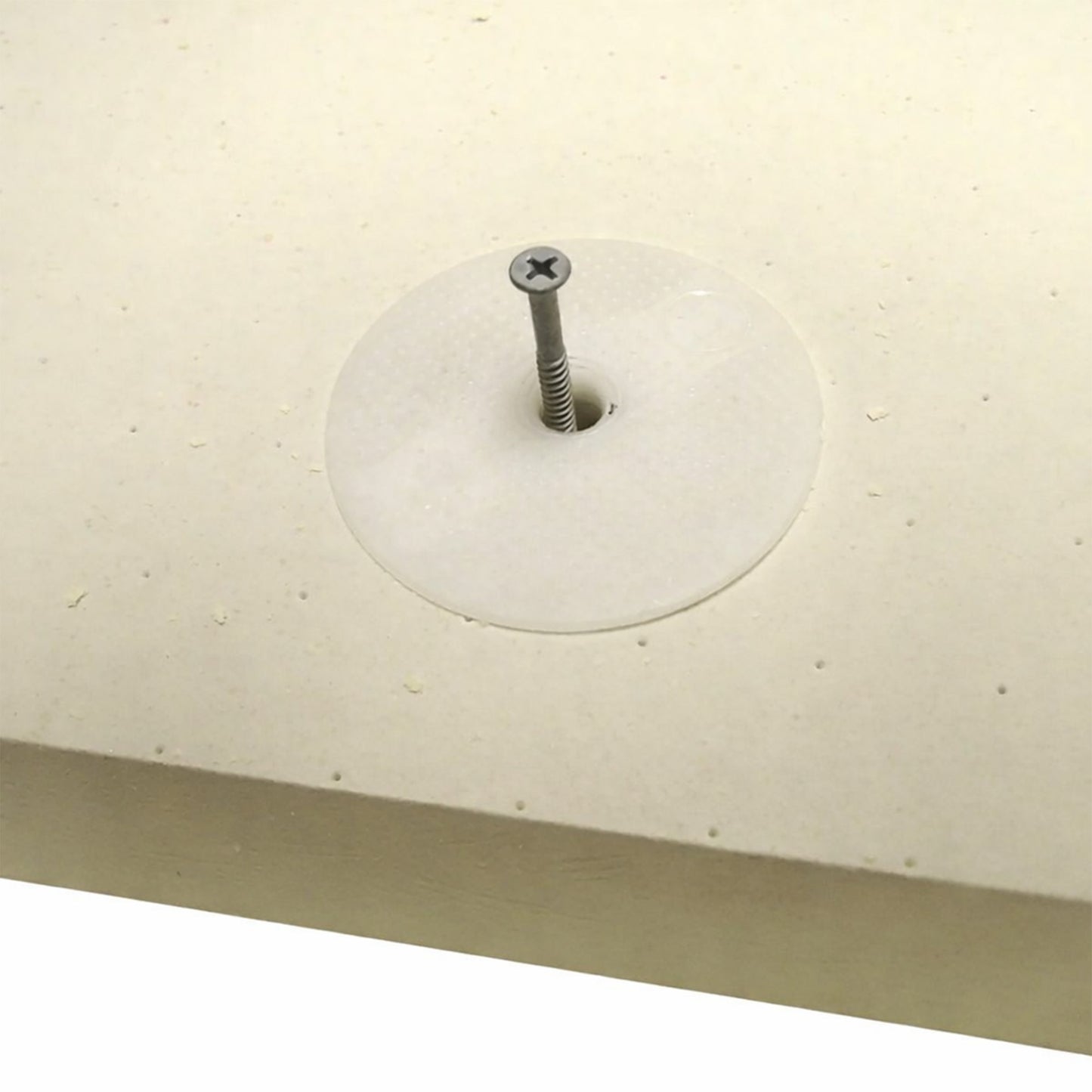 Close-up of a telescopic thermally broken warm deck flat roof fixing installed into a PIR insulation board