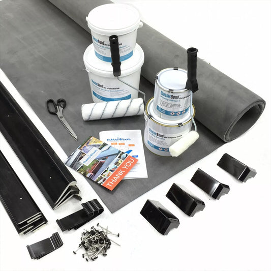 Rubber Roofing installation kit for garden rooms with roll of EPDM mEMBRANE, tools, and accessories on a white background