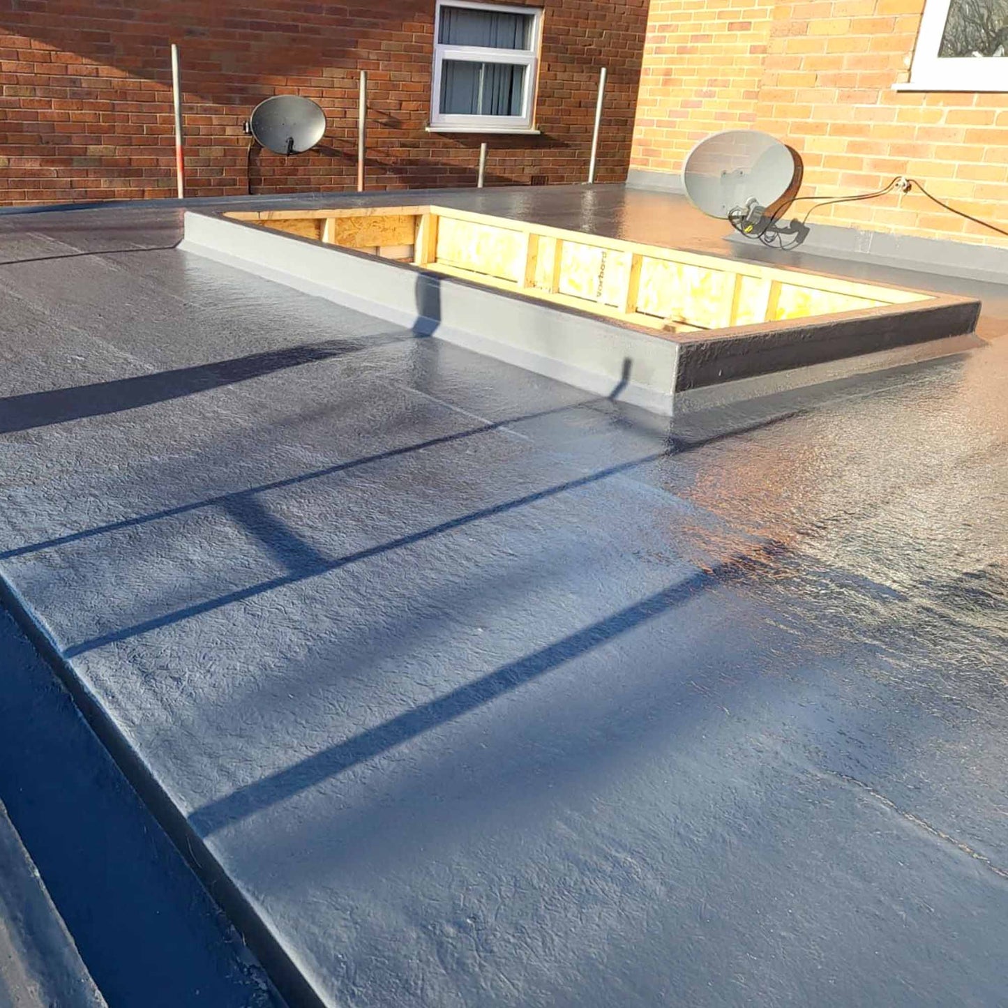 flexitec grp flat roofing system installed on a flat roof with a skylight upstand