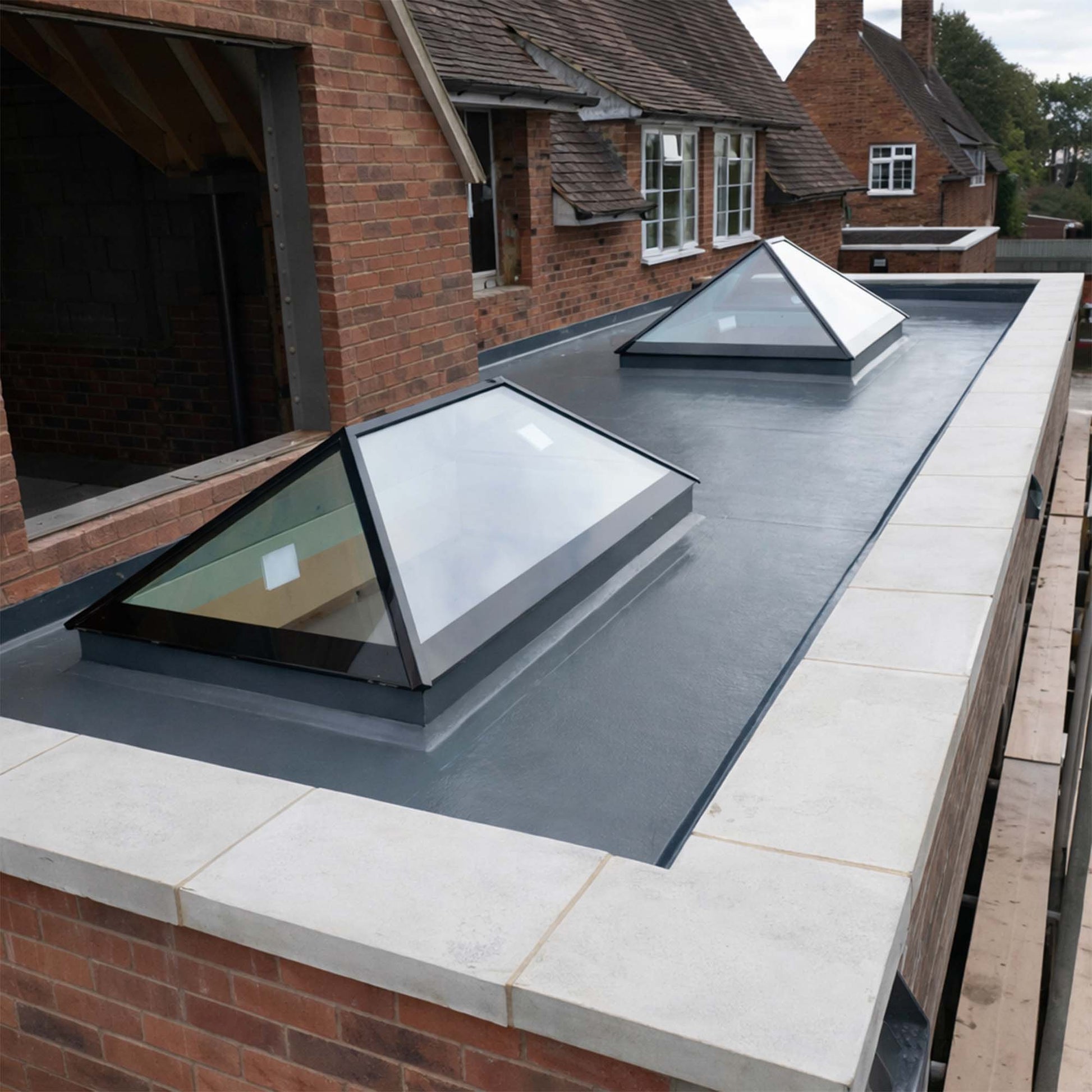 restec grp roof installation on a flat roof with 2 flat roof lanterns