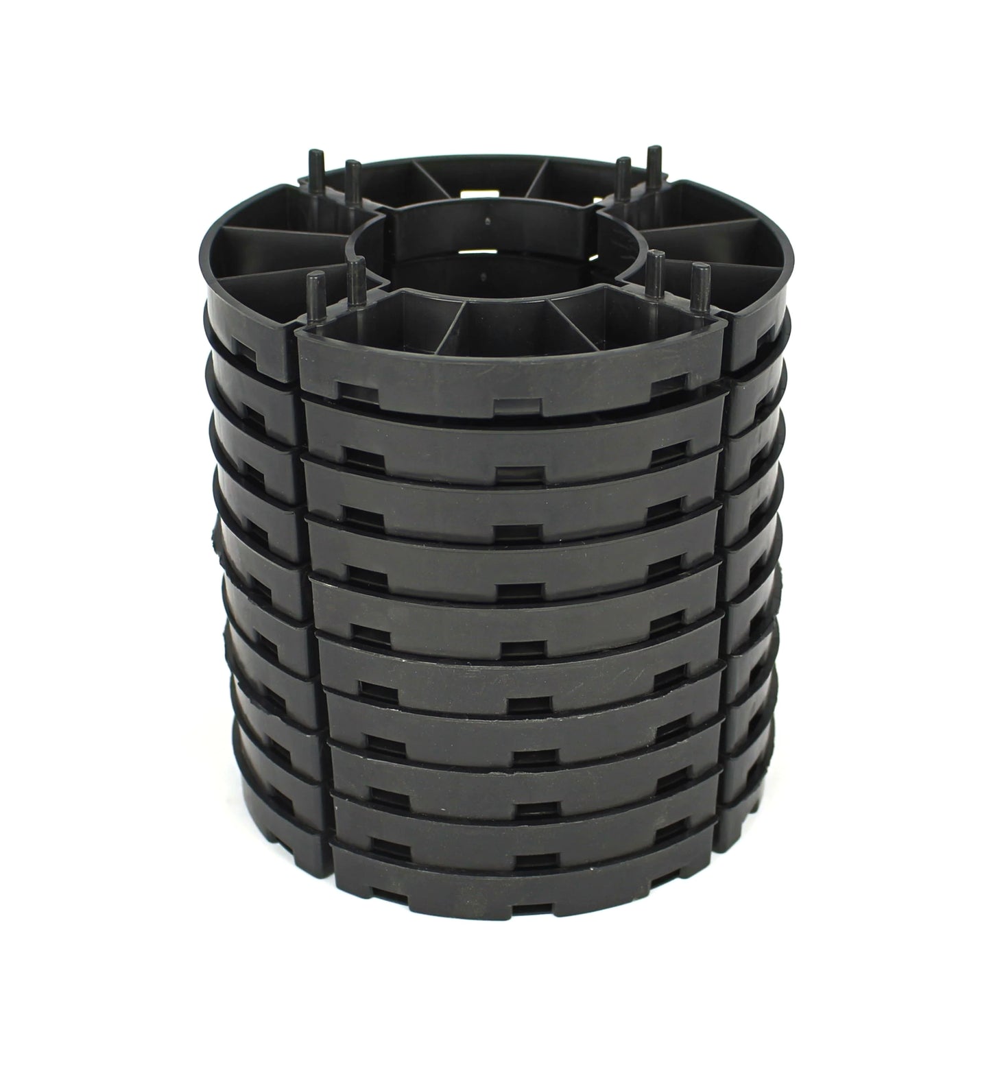 Stack of black 15mm paving supports on a white background