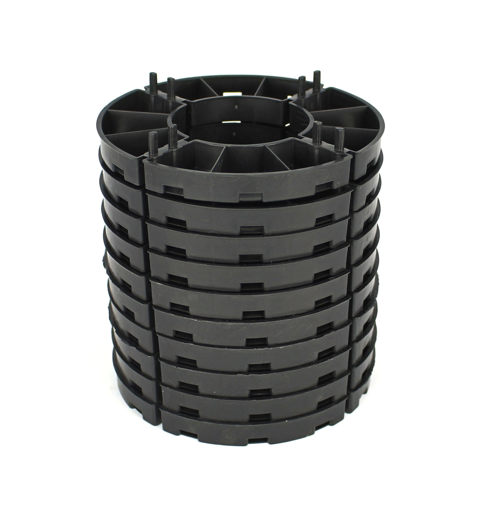 Stack of black 15mm paving supports on a white background